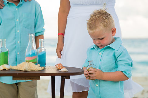 family celebrating a unity sand ceremony for their vow renewal