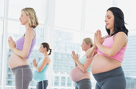 Pregnant women in yoga class