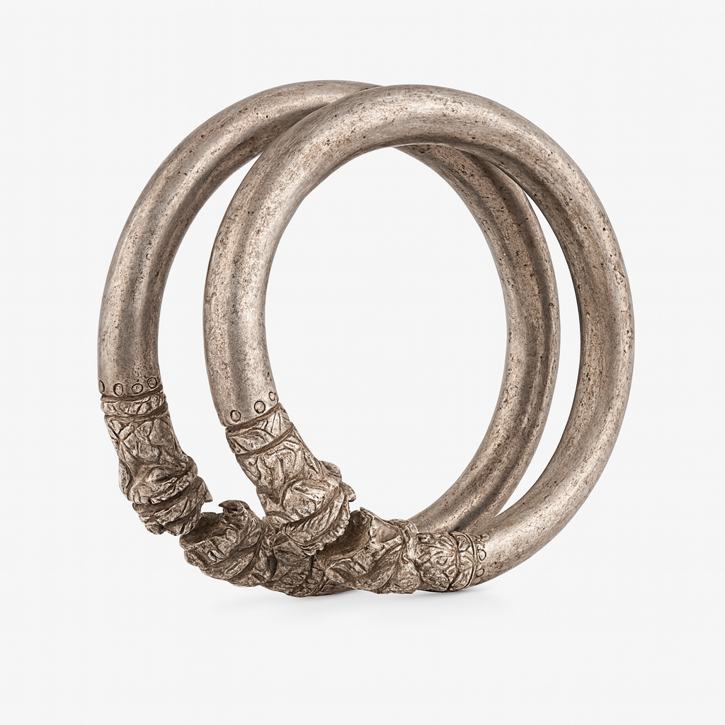 A Pair of Hellenistic Silver Lion-Head Bracelets 3rd-1st century BC