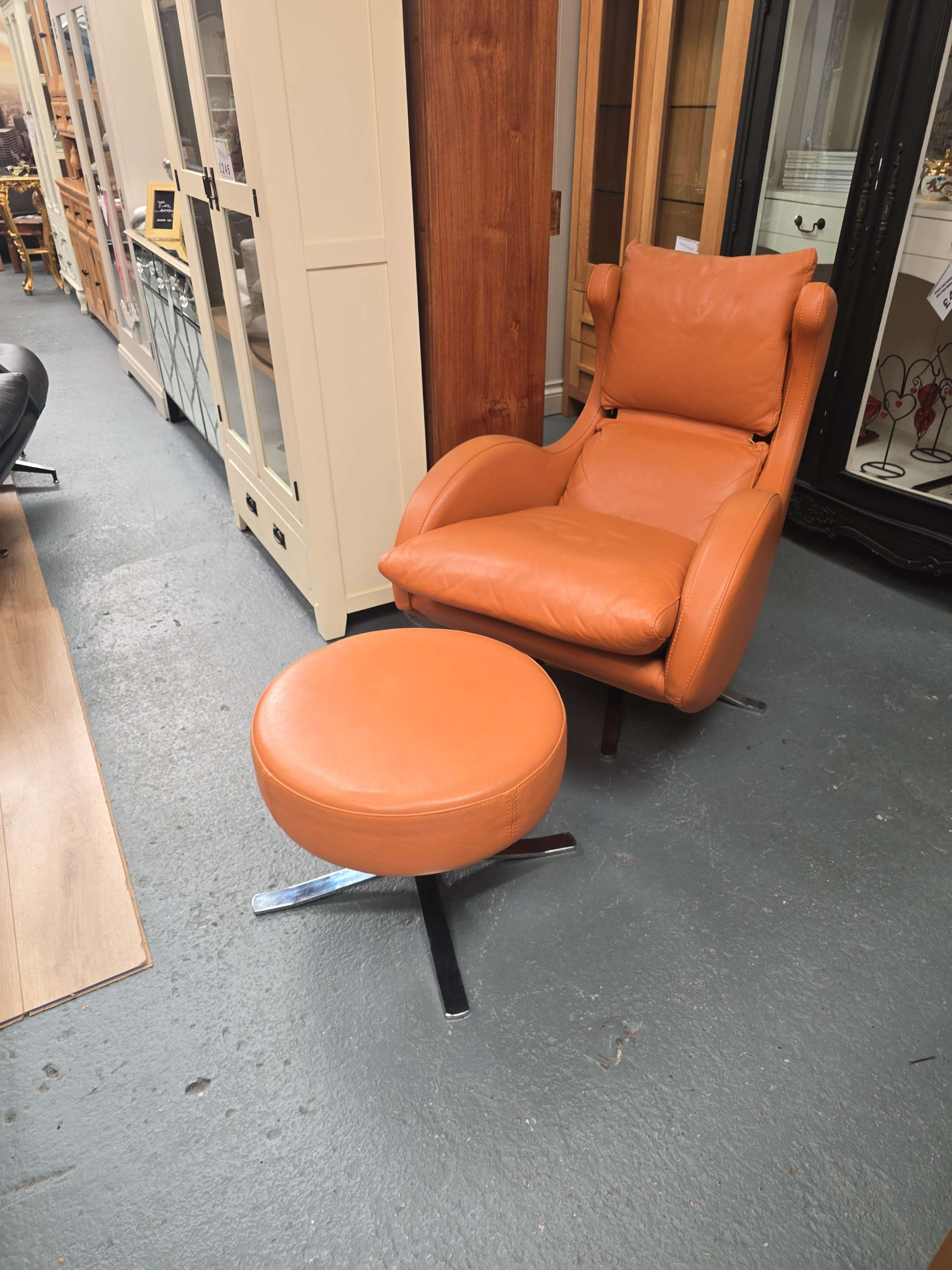 Leather lenny swivel/tilt chair with matching foot stool by fama 