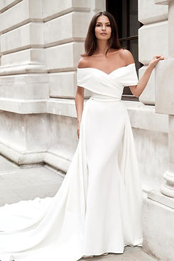 Beautiful girl in Dando London wedding dress outside building