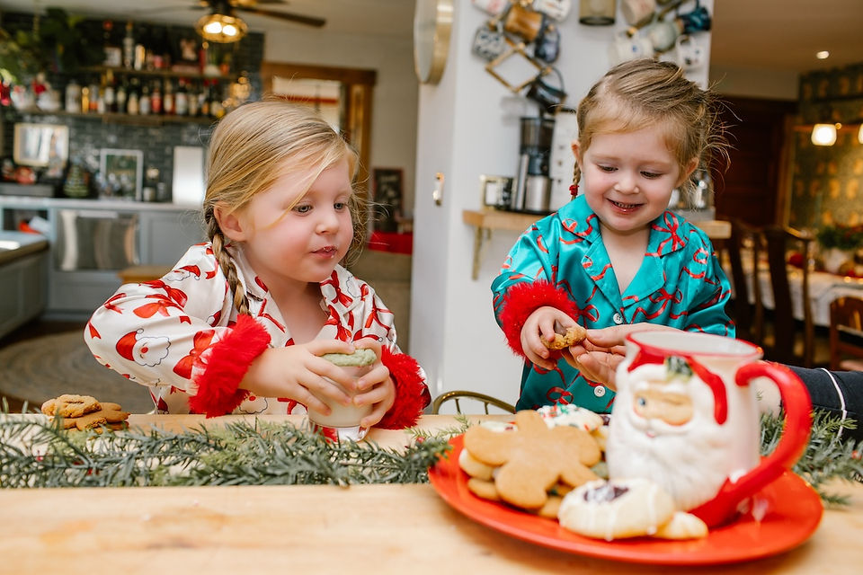 two young children enjoying Christmas Cookies