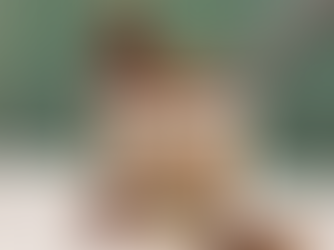 A pint of Drop it Like it's Hot ice cream with a spoon and hot sauce beside it.