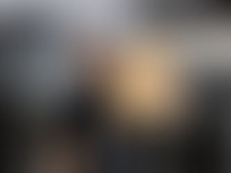 A baker holding a bag of flour