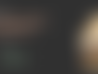 Peach ice cream in a pint with an ice cream cone