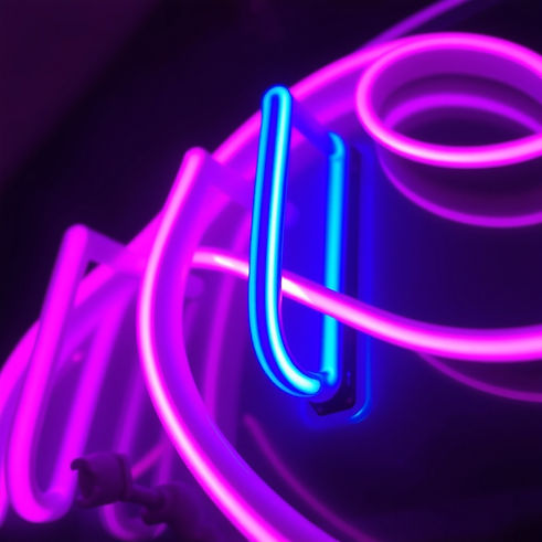 high resolution image of pink, blue and purple neon lights on a close up.jpg