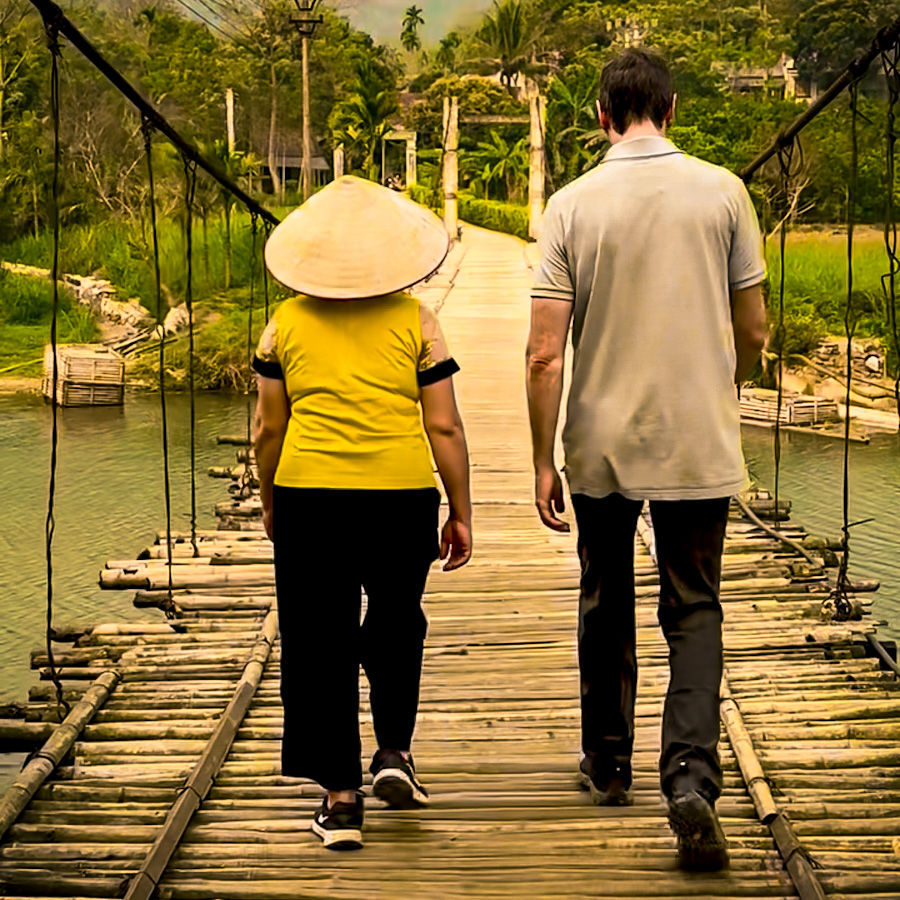 James and our guide, Xuan, crossing a rickety bamboo bridge on the way to Suoi Cham to see the water wheels and try bamboo rafting.