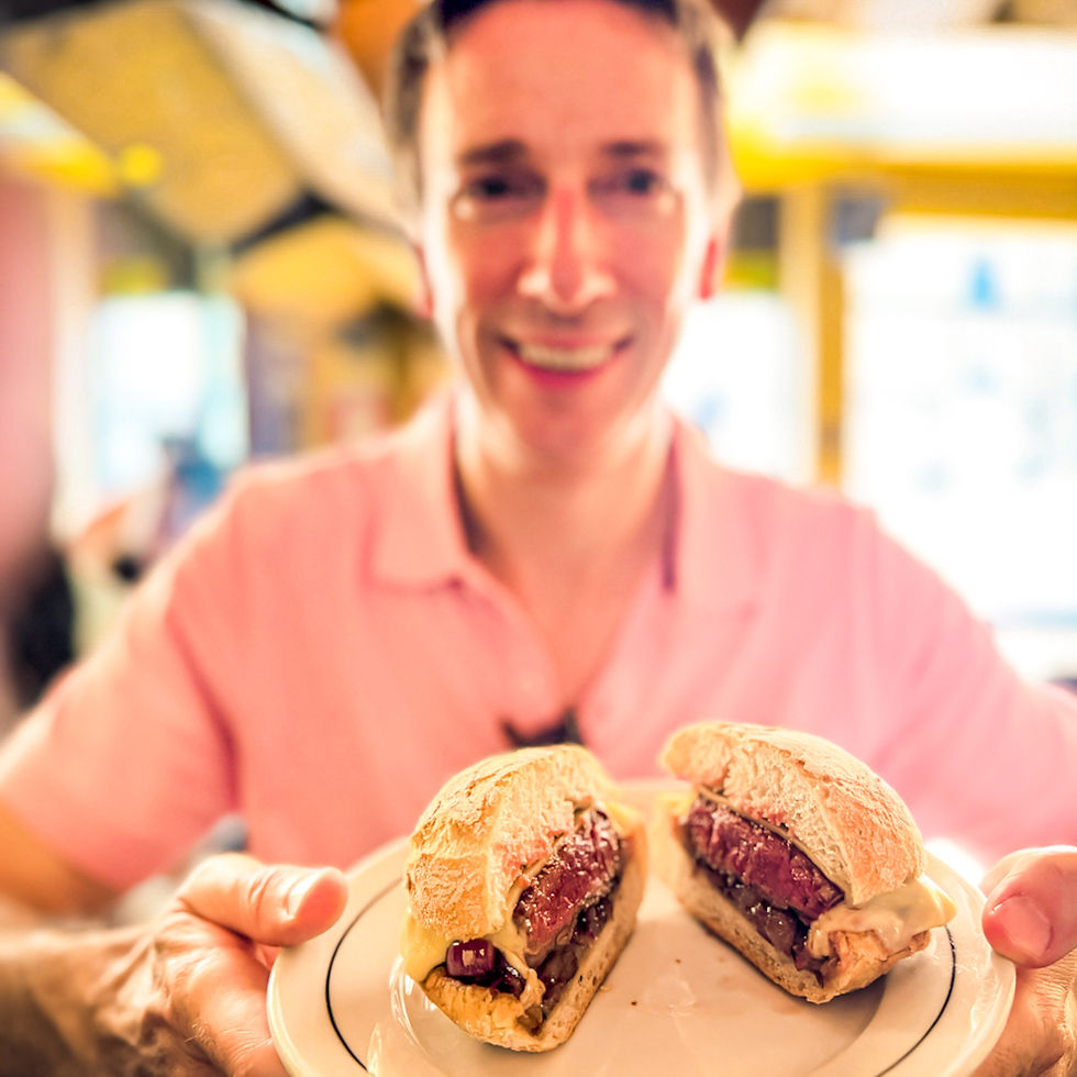 James showing off his beautiful lomo and red onion sandwich at Pregar in Porto, Portugual.