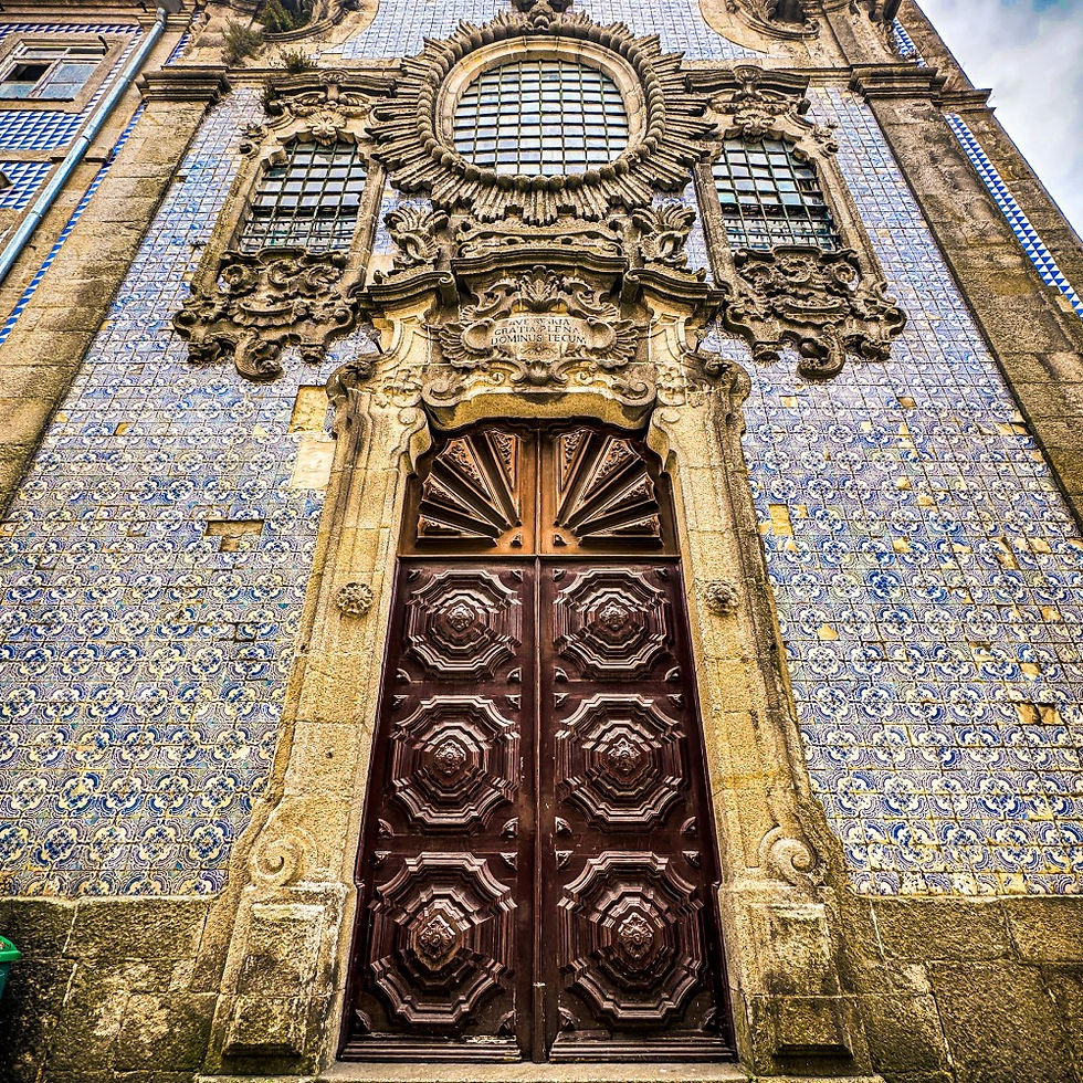 Blue and white tiled facade of a church on Church on Rua de Cimo de Vila in Porto, Portugal.