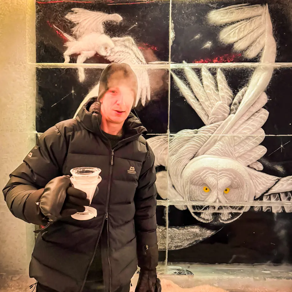James holding an ice glass inside Magic Ice Bar in Tromsø during a Tromso itinerary.