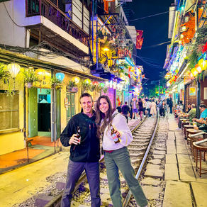 On Hanoi’s famous Train Street—beers in hand, toes on the tracks, and zero trains in sight (for now). Cheers to living on the edge… literally.