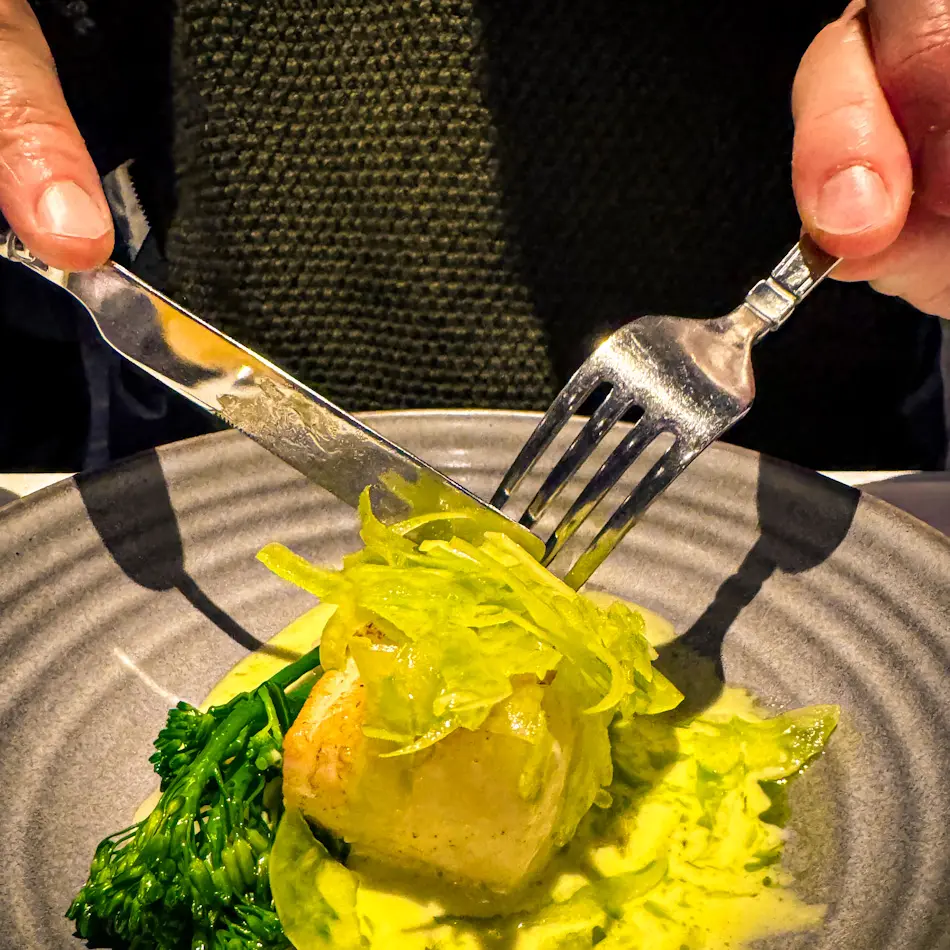 Beautifully plated fish course with greens at Emma’s Dream Kitchen, featured in our guide to the best restaurants in Tromso.