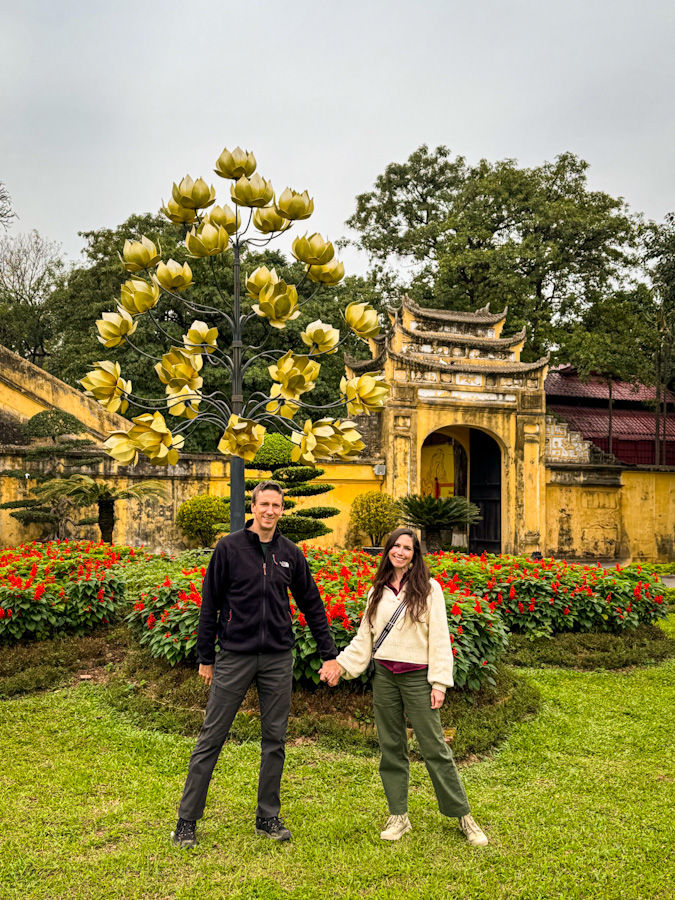 Holding hands where emperors once held court in front of the UNESCO-listed Imperial Citadel of Thang Long, a key thing to do in Hanoi.