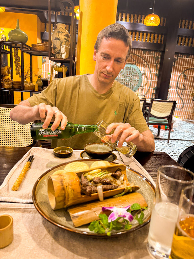 James about to tuck into grilled beef in bamboo at Viet Rice Essence—chef’s kiss.