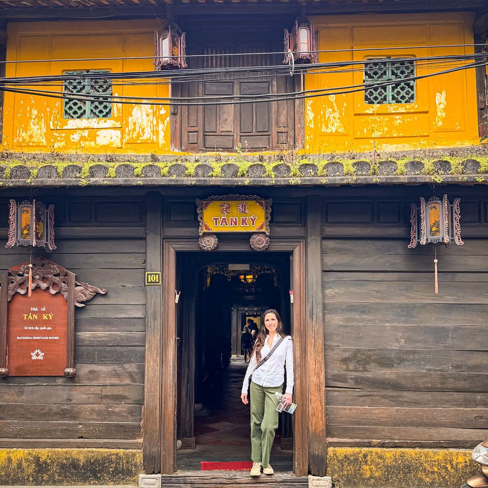 Things to do in Hoi An: Standing in the doorway of the Old House Tan Ky — one of the most iconic and well-preserved homes in Hoi An. Built in 1741, it’s a perfect blend of Japanese, Chinese, and Vietnamese architecture, and a reminder of the city’s vibrant trading past.