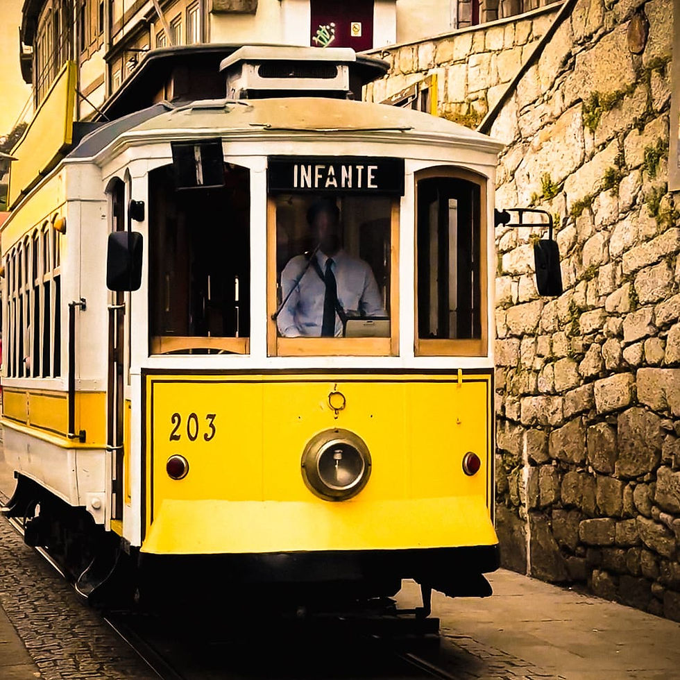 Porto Travel Tips: Yellow vintage trolley coming toward you in Porto