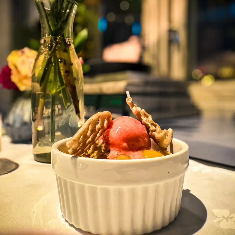Elegant plated dessert with ice cream at Emma’s Dream Kitchen, one of the best restaurants in Tromso for tasting menus.