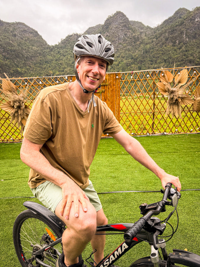 James on a bicycle in Viet Hai village on Cat Ba Island - a day trip on a 2 night Ha Long Bay cruise