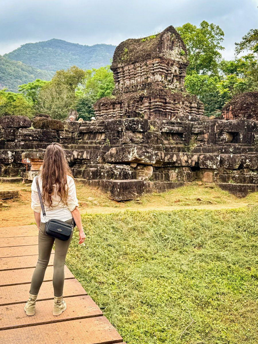 Shal taking in the temple at My Son Sanctuary, framed by the jungle’s wild embrace — a perfect blend of ancient history and nature’s power.