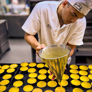 Pastel de natas in the making at Fábrica da Nata in Porto.
