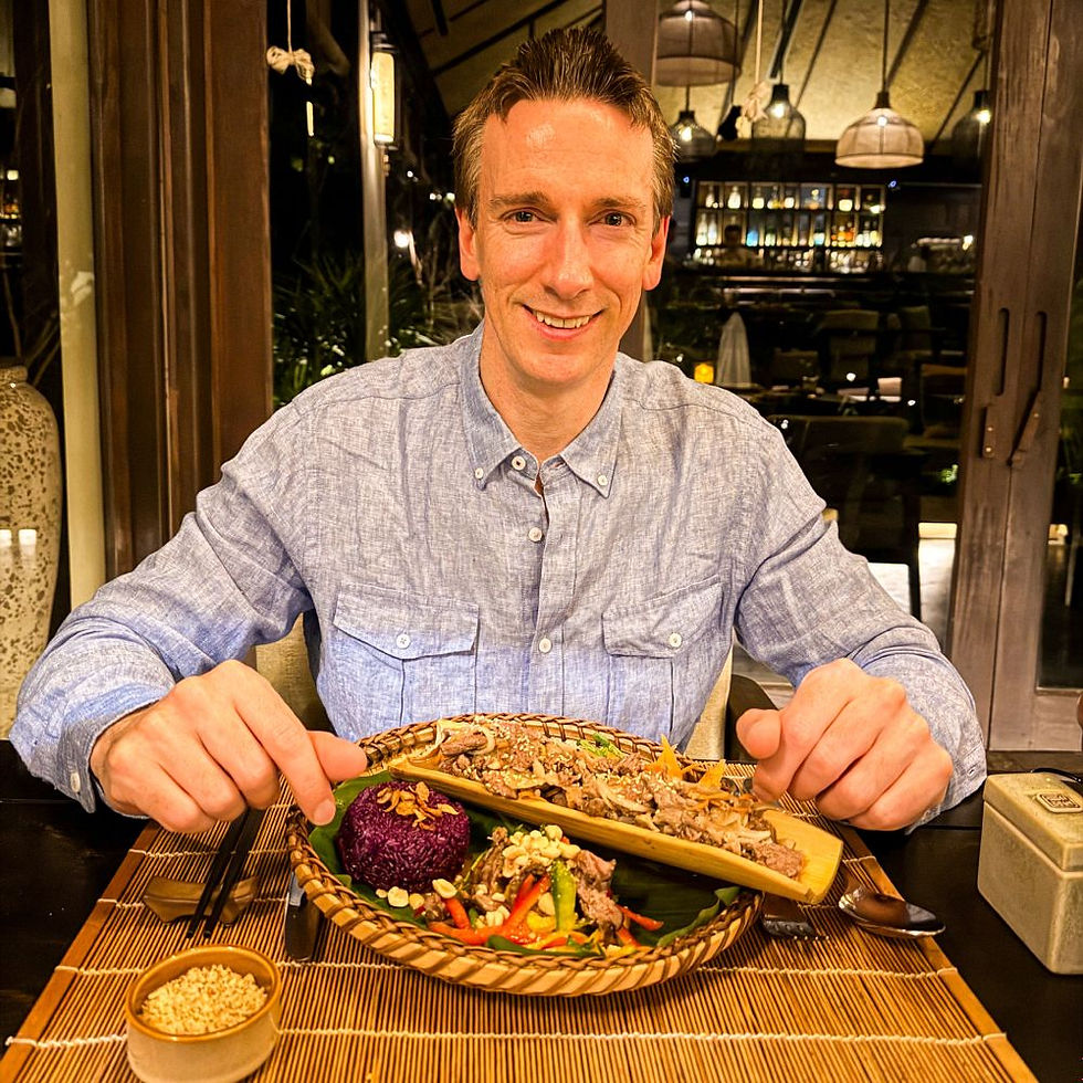 Avana Retreat_James about to tuck into beef in a bamboo tube at Green Chili Restaurant, but don't worry, there's Western fare too if that's more your speed.