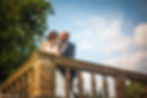 Wedding couple posting on balcony
