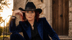 Jayne Denham in a Blue Suit and Black Cowboy Hat for ANGEL OF MERCY