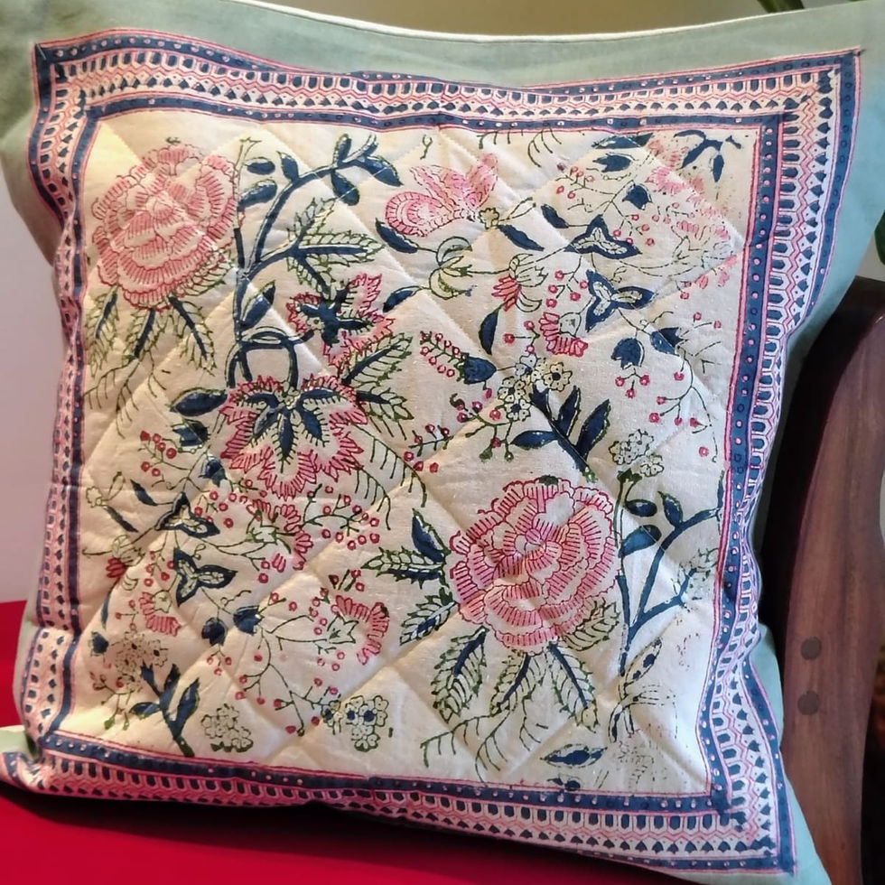 Handcrafted quilted cotton cushion covers with block-printed patterns and textured detailing.
