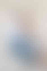 couple in blue outfit sitting on stairs at jefferson memorial DC