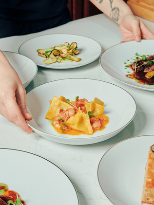 Snapshots of bespoke dishes created for private dining experiences.