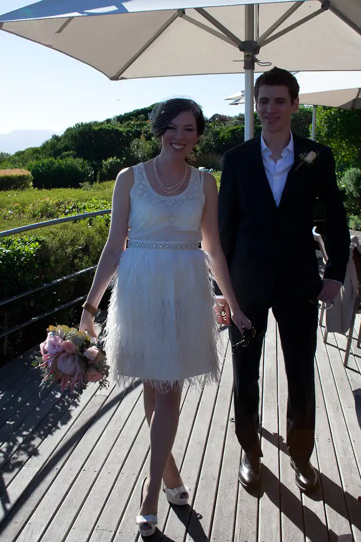 real couple wedding outdoors feather skirt and beaded top 50s style wedding dress gown