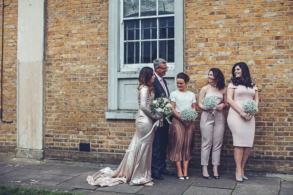 bride and bridesmaids in blush pink colors sequin wedding dress