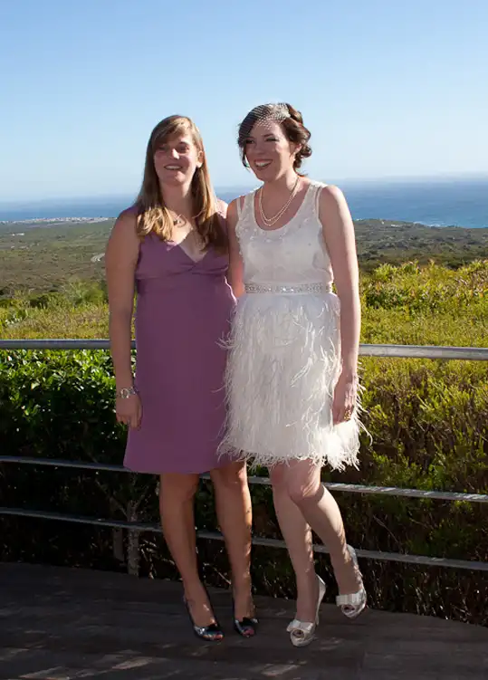 real couple wedding outdoors feather skirt and beaded top 50s style wedding dress gown