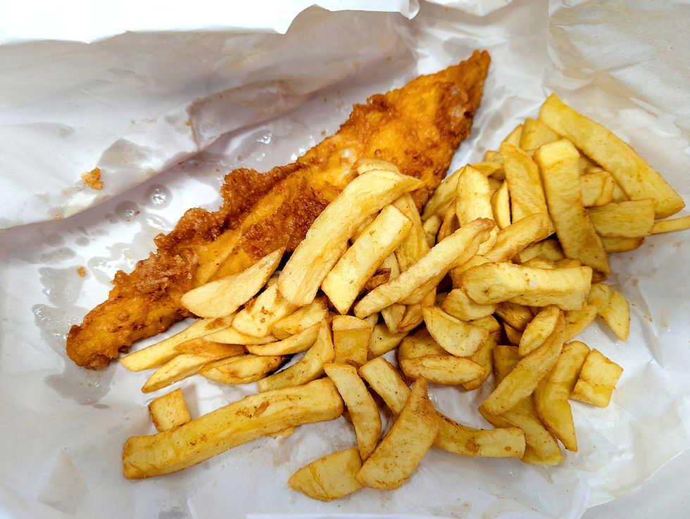 Fish and Chips from the Golden Chip of Hanwell on paper with golden crispy fish and large thick chips