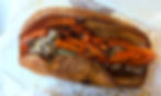 A freshly made Yorkshire pudding roast wrap from The York Roast Company, filled with roast beef and gravy. A street food must-try for places to eat in York.