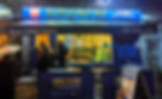 The blue and gold exterior of Urumchi restaurant in London, a must-visit for authentic Xinjiang cuisine.