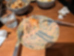A messy plate after devouring Buk’s pulled brisket burger, covered in rich sauce.