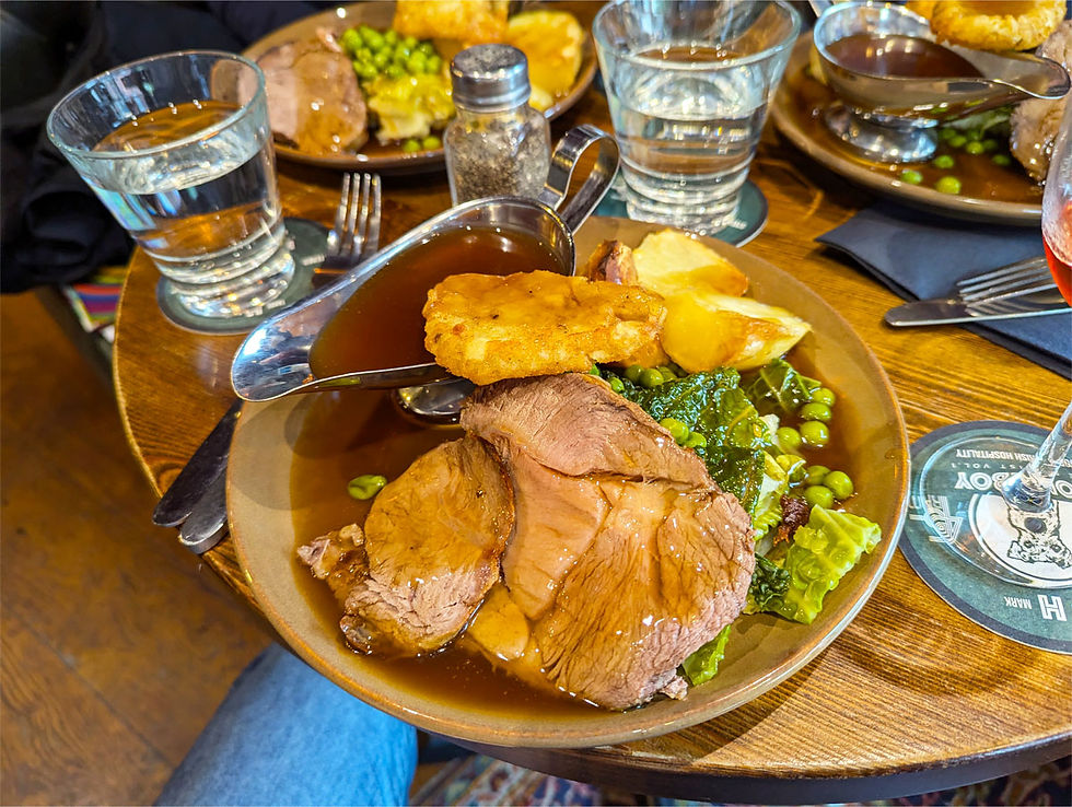 Homeboy's Irish roast beef dinner with Irish pudding on top and extra gravy boat.