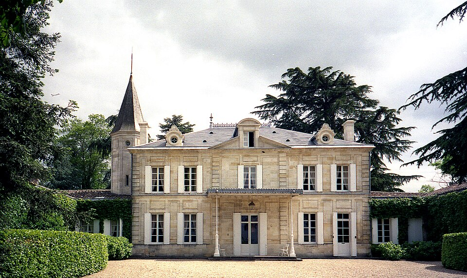 French château exterior with corner turret and gravel courtyard, historic property restoration } Cross-border Turn key design and delivery EMdot Studio
