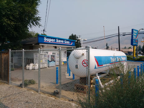 Chain link fence barrier to protect a propane tank. commercial fence.
