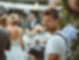 Smiling wedding photographer candid