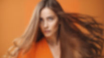 orange background with a long hair lady in the front#.jpg