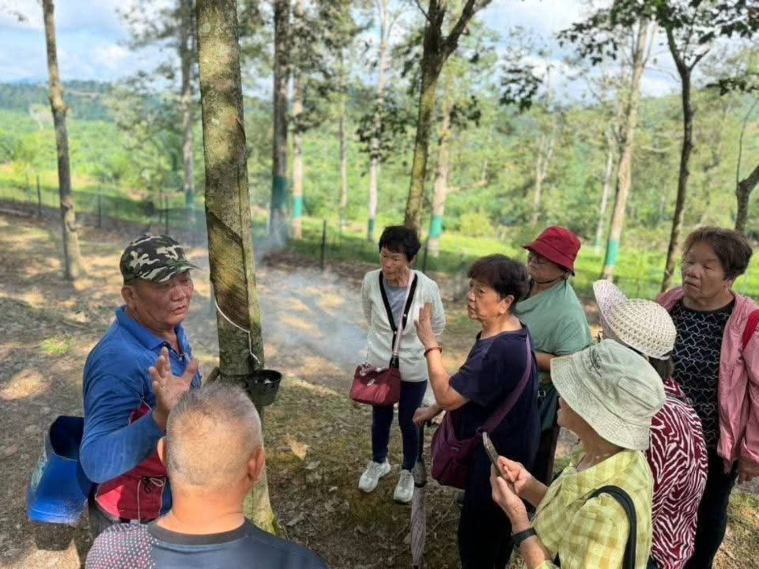School students learning rubber tapping at Potai Farmstay