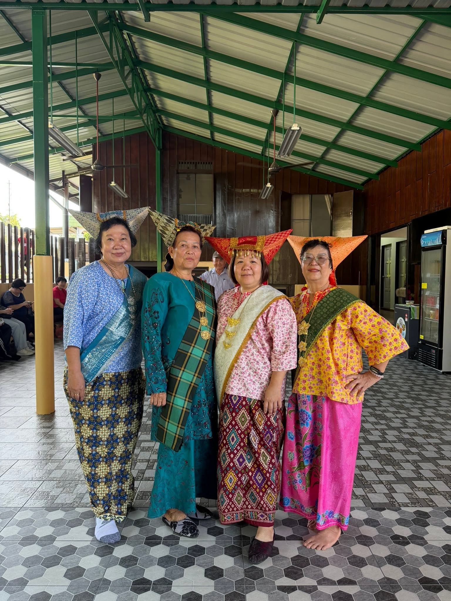 Guests near a station during a Potai Farmstay journey in Negeri Sembilan