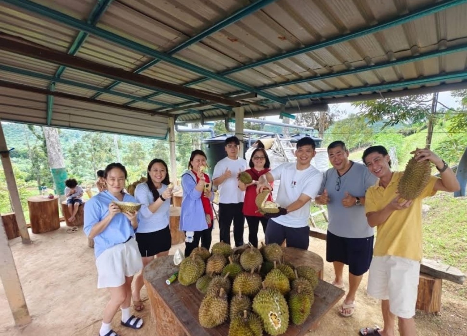 Weekend family guests enjoying durian experience at Potai Farmstay