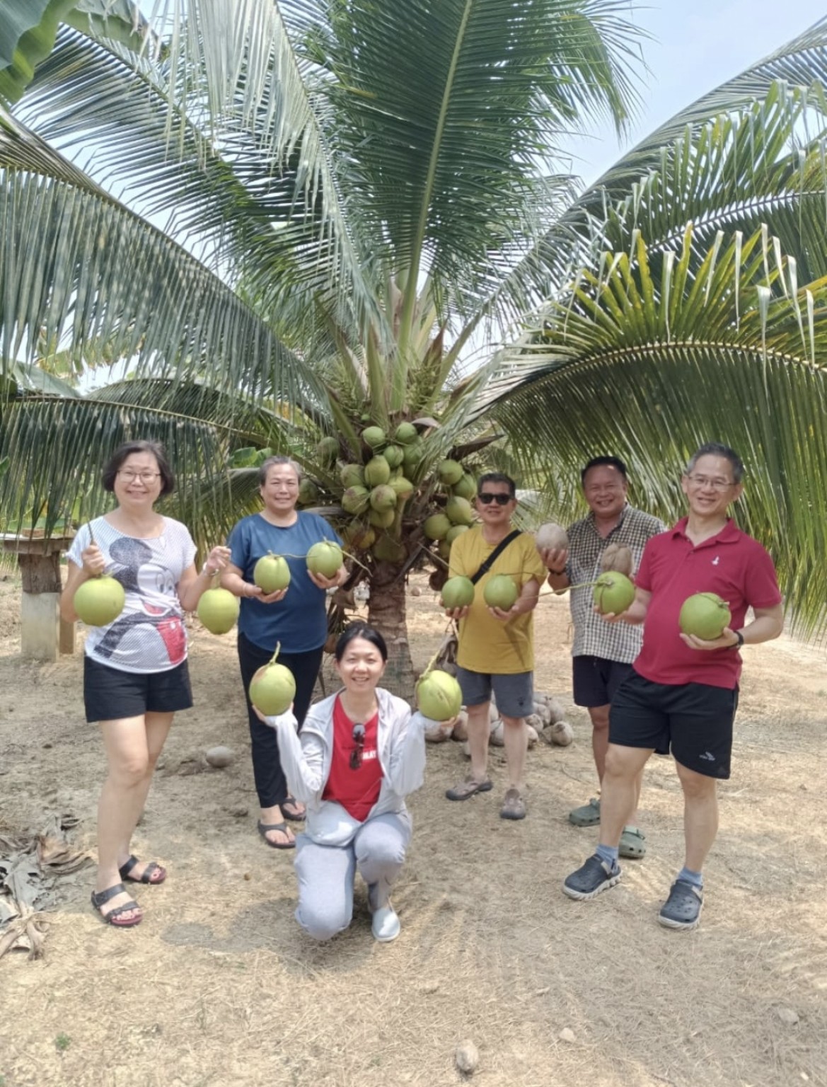 Family group coconut farm visit at Potai Farmstay