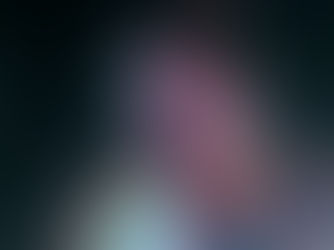 Cameron Whitcomb performing at The Music Box in San Diego, shirtless vocalist with chest tattoos singing with intense expression under warm stage lighting