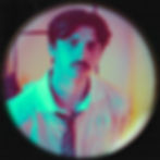 Michael Stolar is shown in a stylized, neon-lit portrait with teal and pink lighting, wearing a white shirt and loosened tie, looking directly at the camera through a circular vignette effect.