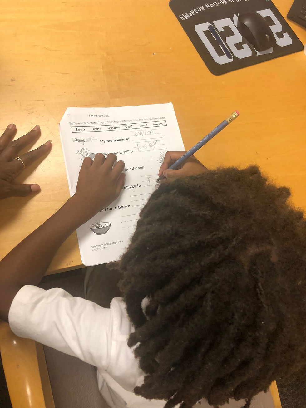 student working on hand writing