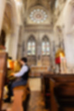 Boy play organ at downside